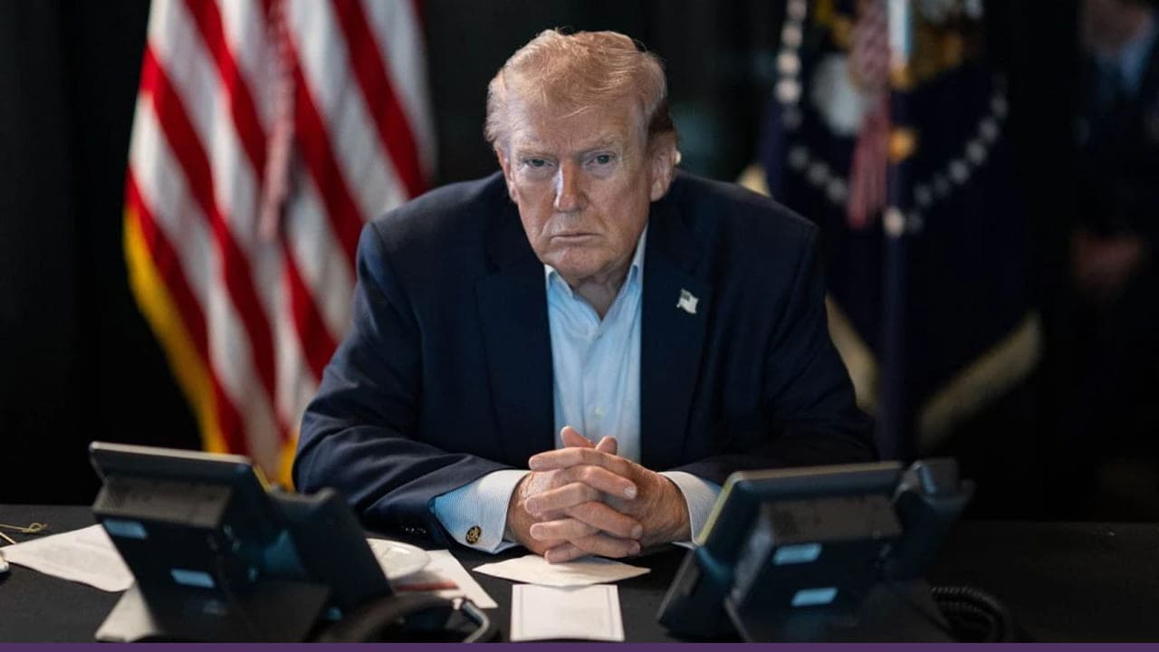 Trump seated discussing escalating tensions and diplomacy with Iran